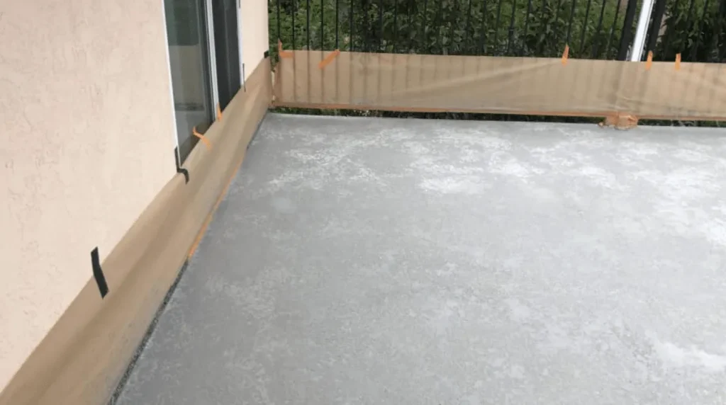 Light flake-finish deck behind a railing