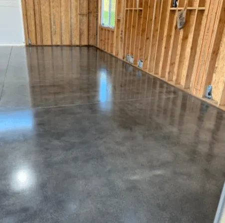 High-gloss polished concrete floor in a wood-framed room