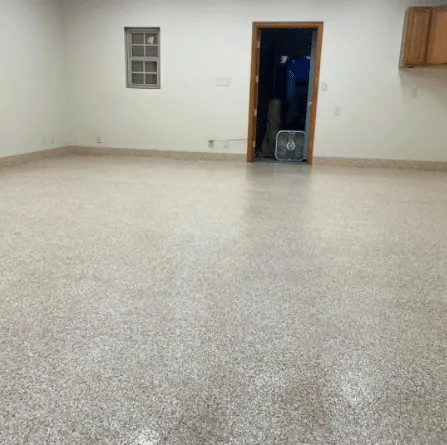 Speckled urethane cement floor in an empty room